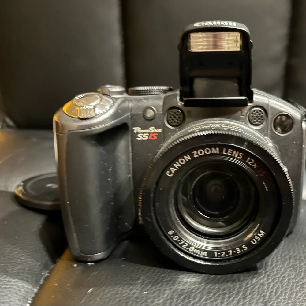 canon powershot s5 is with 2 lens covers and bag